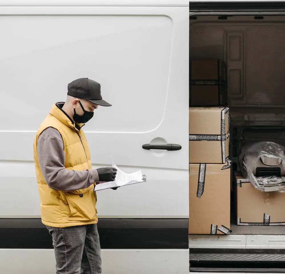 Courier with checkboard around side of van