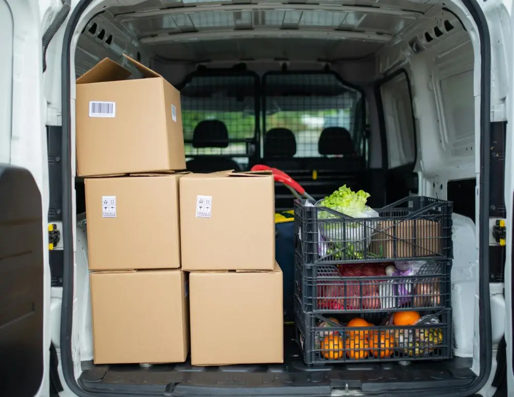 boxes of groceries in the back of van